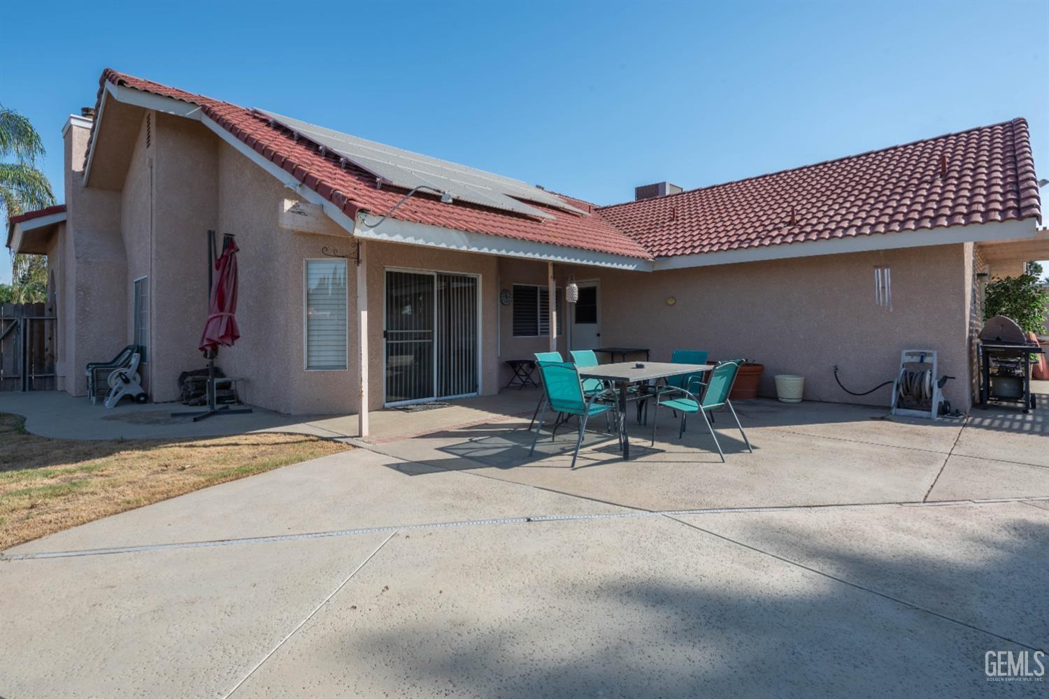 Undisclosed Address Bakersfield, CA 93314 - Photo 27 of 31 a view of a patio with table and chairs and potted plants