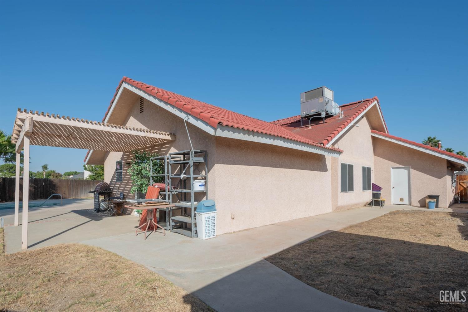 Undisclosed Address Bakersfield, CA 93314 - Photo 28 of 31 a view of a house with backyard and porch
