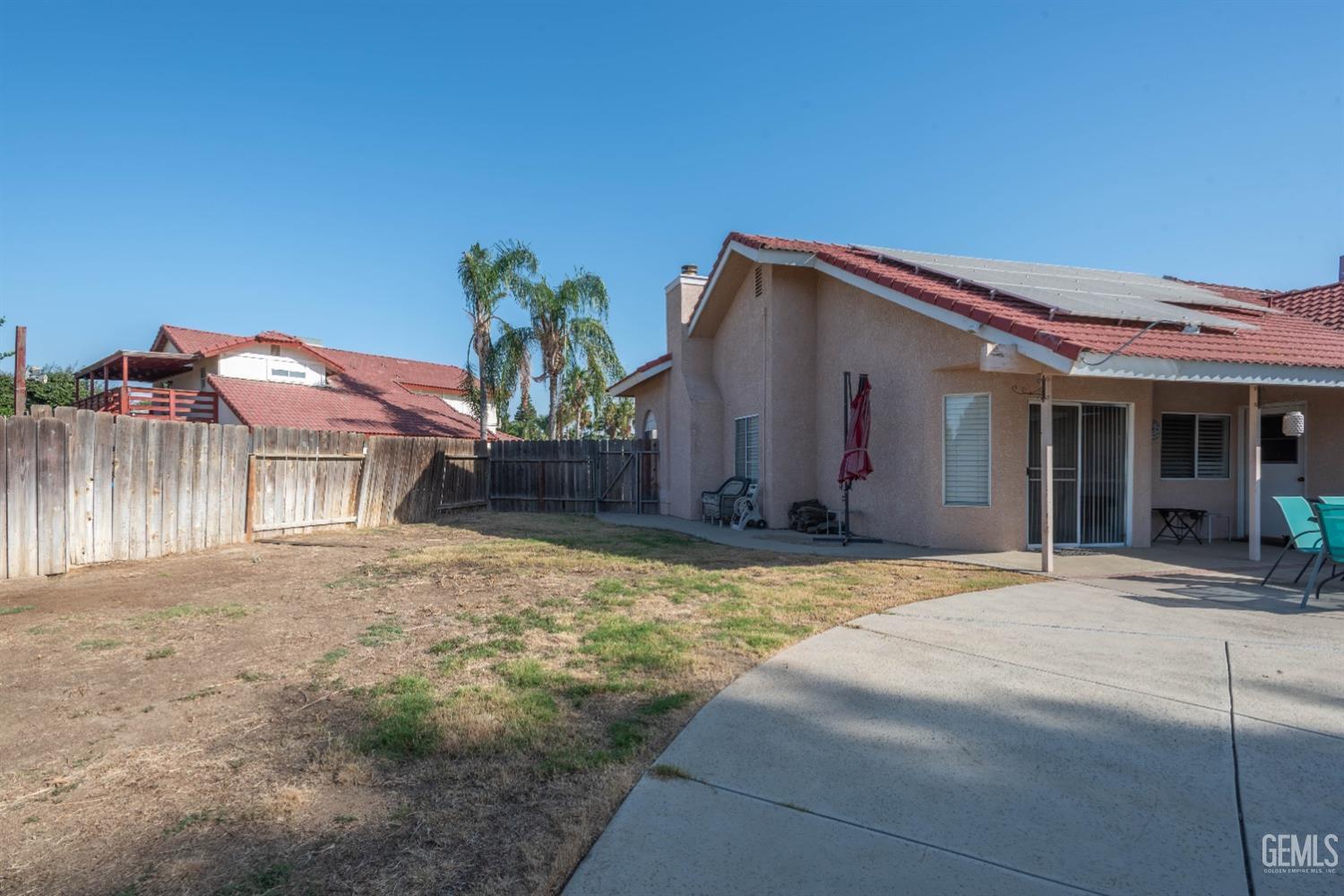 Undisclosed Address Bakersfield, CA 93314 - Photo 30 of 31 a front view of a house with a yard and garage