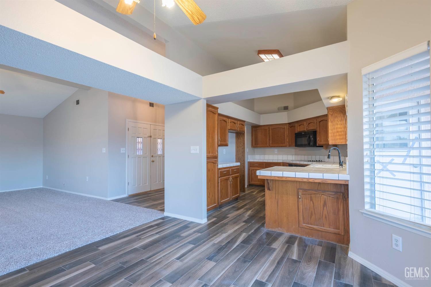 Undisclosed Address Bakersfield, CA 93314 - Photo 9 of 31 a kitchen with a sink and a stove top oven