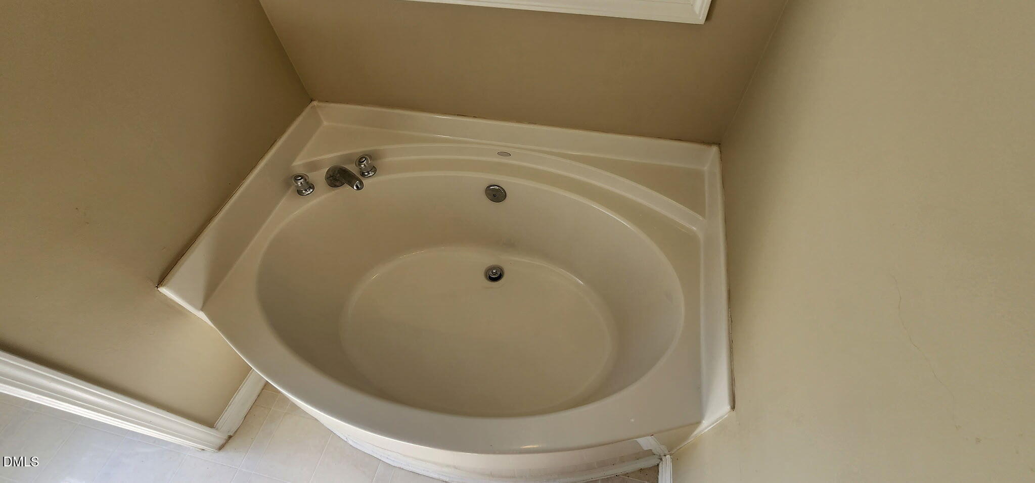 8165 Rolling Glenn Drive Raleigh, NC 27616 - Photo 12 of 14 a bathroom with a bathtub