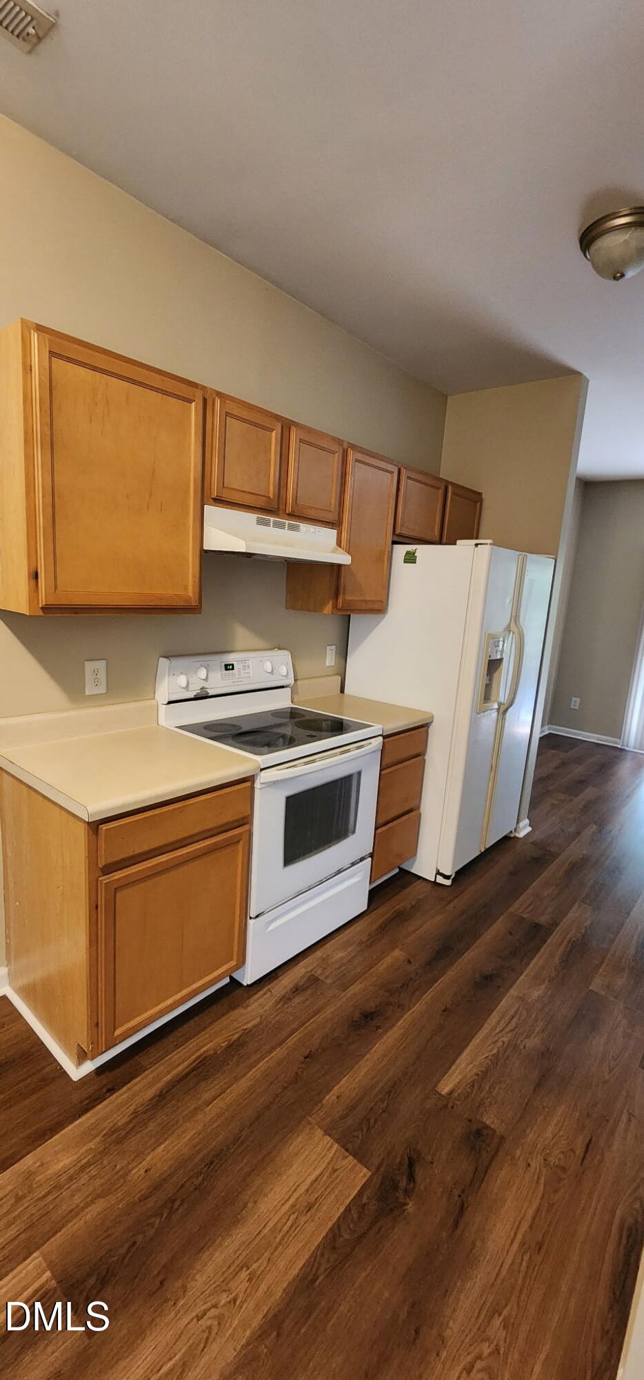 8165 Rolling Glenn Drive Raleigh, NC 27616 - Photo 5 of 14 a kitchen with wooden floors and a stove
