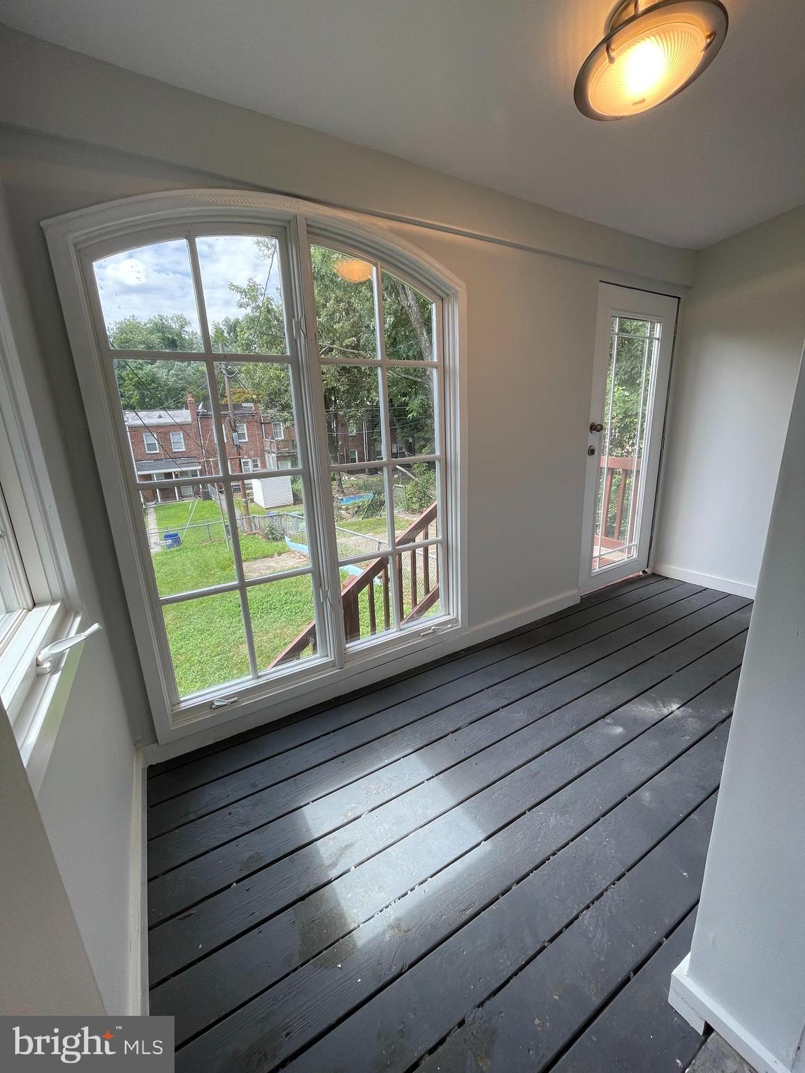 4540 Manorview Road Baltimore, MD 21229 - Photo 11 of 16 a view of a room with wooden floor and window