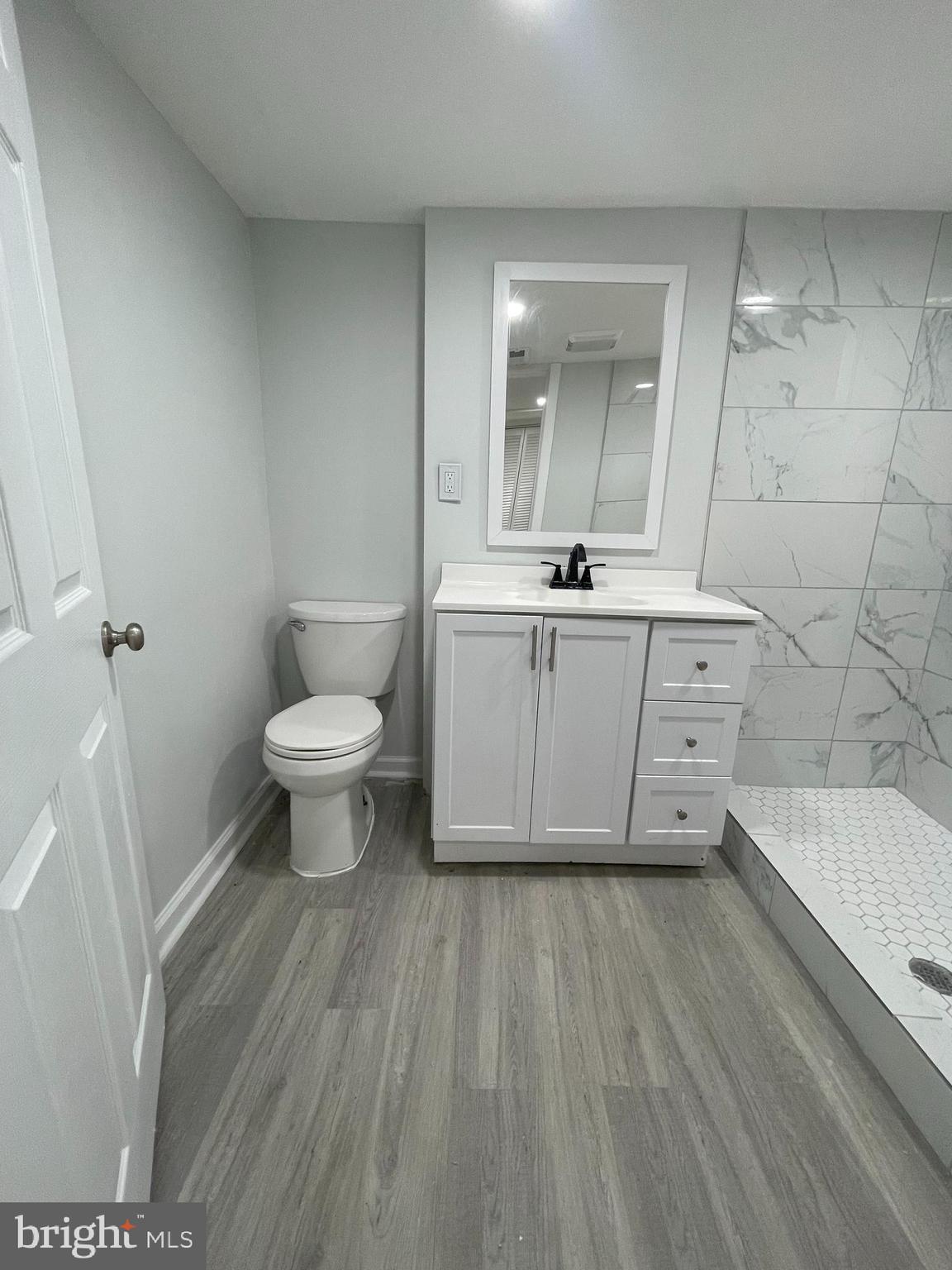 4540 Manorview Road Baltimore, MD 21229 - Photo 15 of 16 a bathroom with a sink a toilet and bathtub