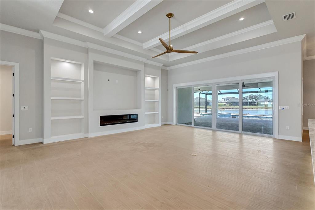 1613 148th Terrace East Parrish, FL 34219 - Photo 15 of 81 a view of an empty room with a window and a ceiling fan