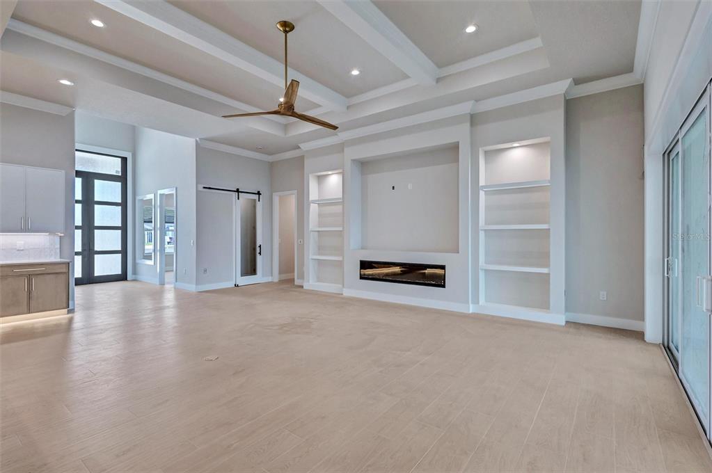 1613 148th Terrace East Parrish, FL 34219 - Photo 16 of 81 a view of an empty room with a window and a kitchen