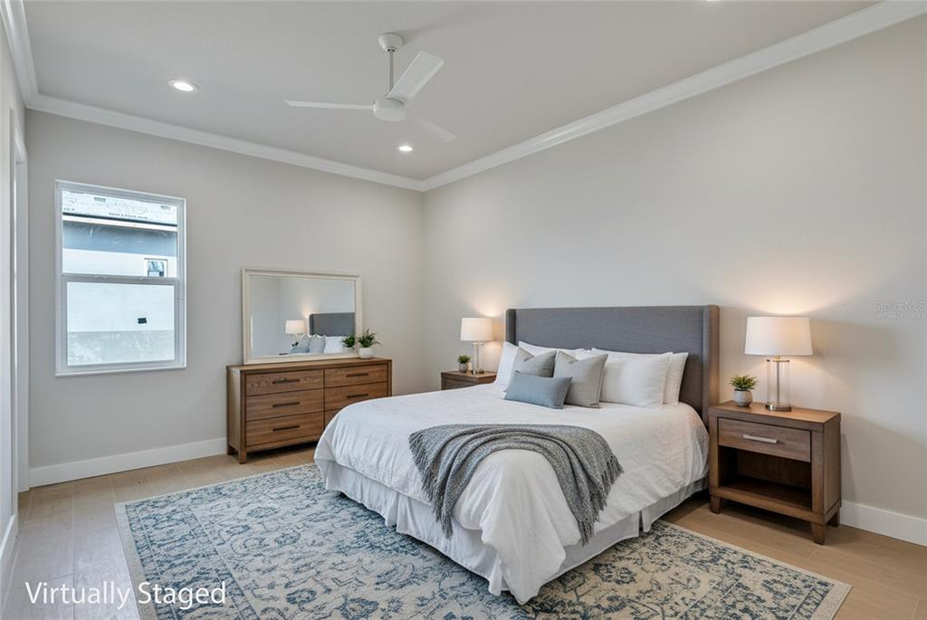 1613 148th Terrace East Parrish, FL 34219 - Photo 58 of 81 a bedroom with a bed and wooden floor