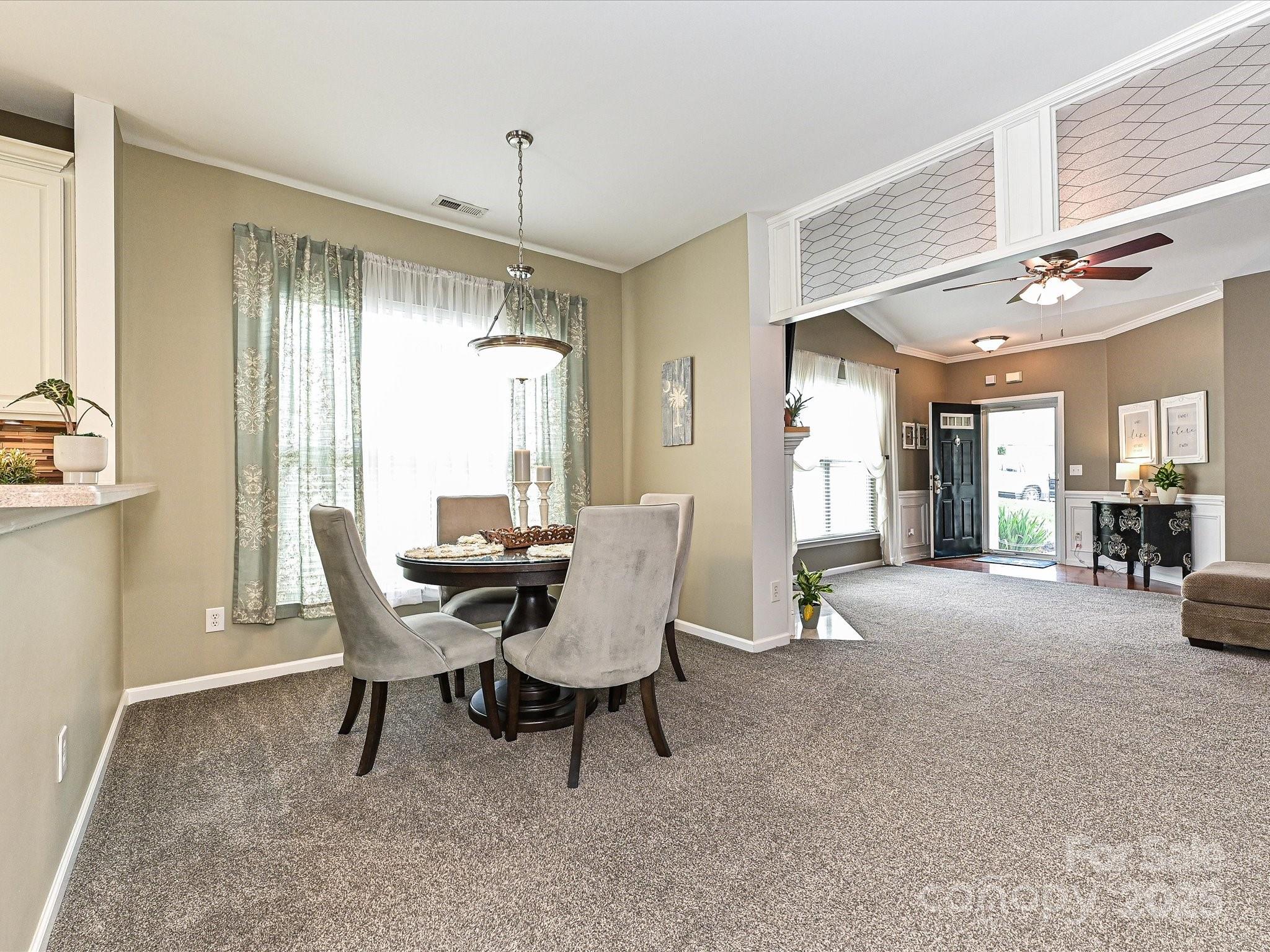 460 Silver Cypress Lane Fort Mill, SC 29708 - Photo 11 of 29 a dining room with furniture and window