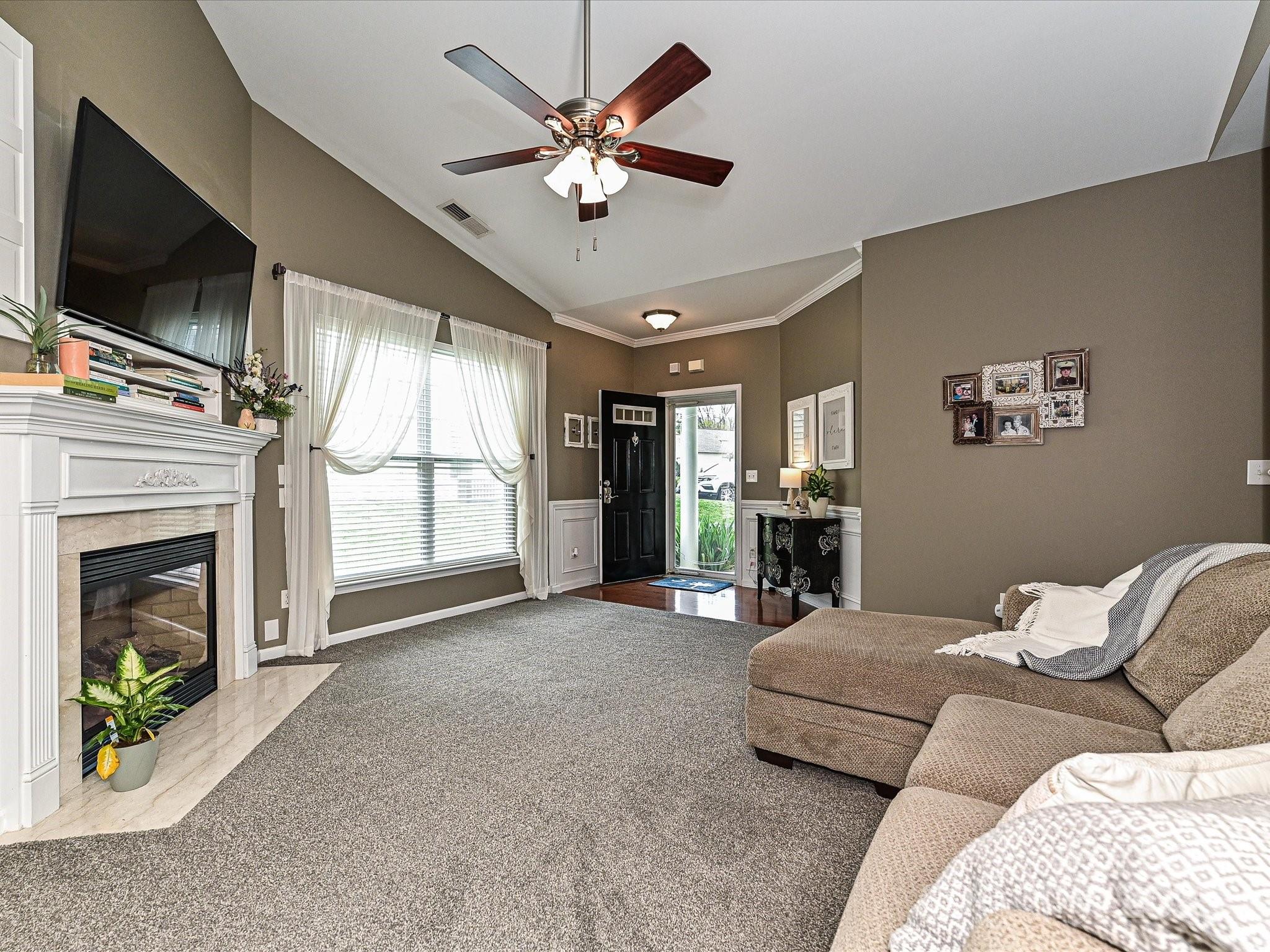 460 Silver Cypress Lane Fort Mill, SC 29708 - Photo 12 of 29 a living room with furniture fireplace and flat screen tv