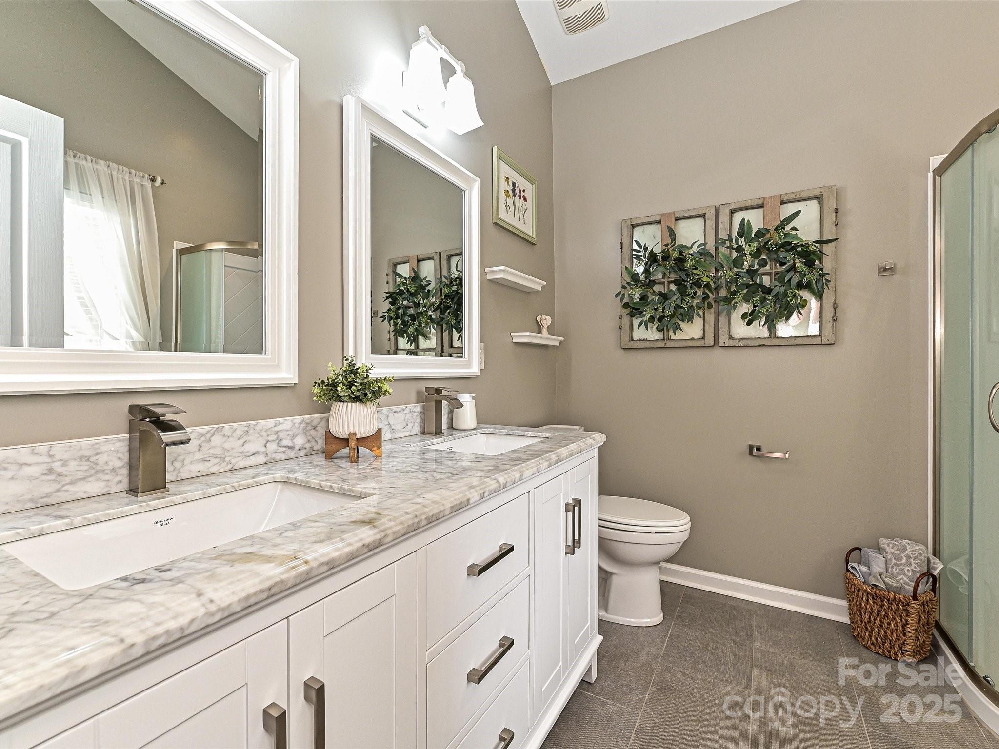 460 Silver Cypress Lane Fort Mill, SC 29708 - Photo 15 of 29 a bathroom with a granite countertop sink a toilet and a mirror