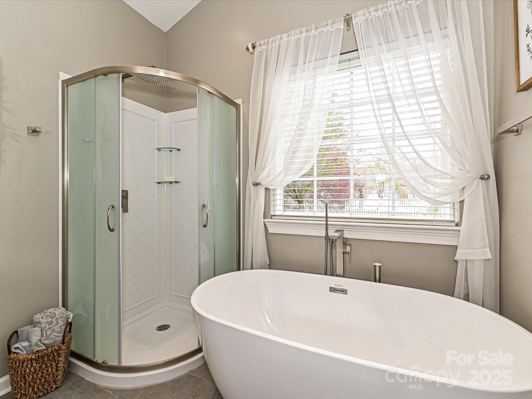 460 Silver Cypress Lane Fort Mill, SC 29708 - Photo 16 of 29 a bathroom with a bathtub and a shower