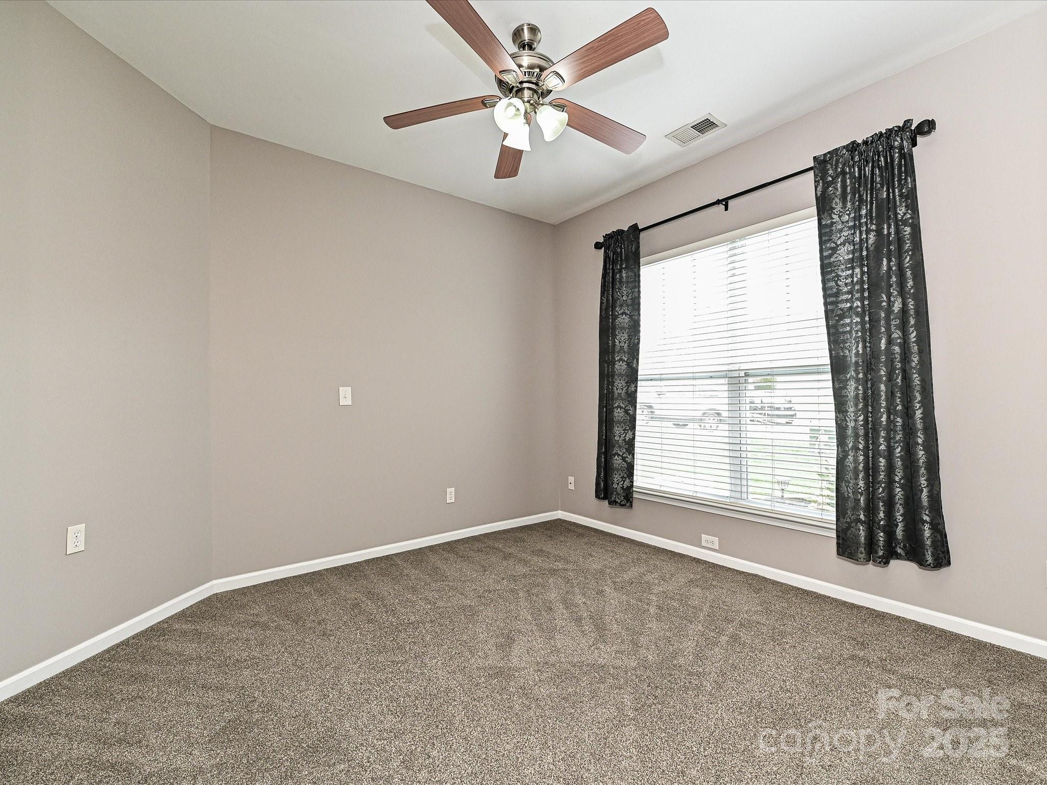 460 Silver Cypress Lane Fort Mill, SC 29708 - Photo 20 of 29 a view of an empty room with a window