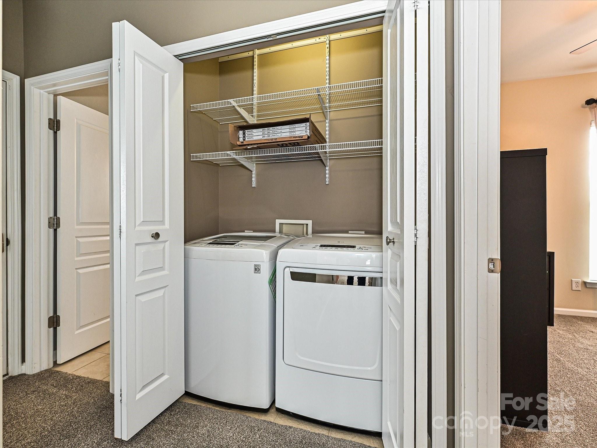 460 Silver Cypress Lane Fort Mill, SC 29708 - Photo 21 of 29 a view of storage and utility room with washer and dryer