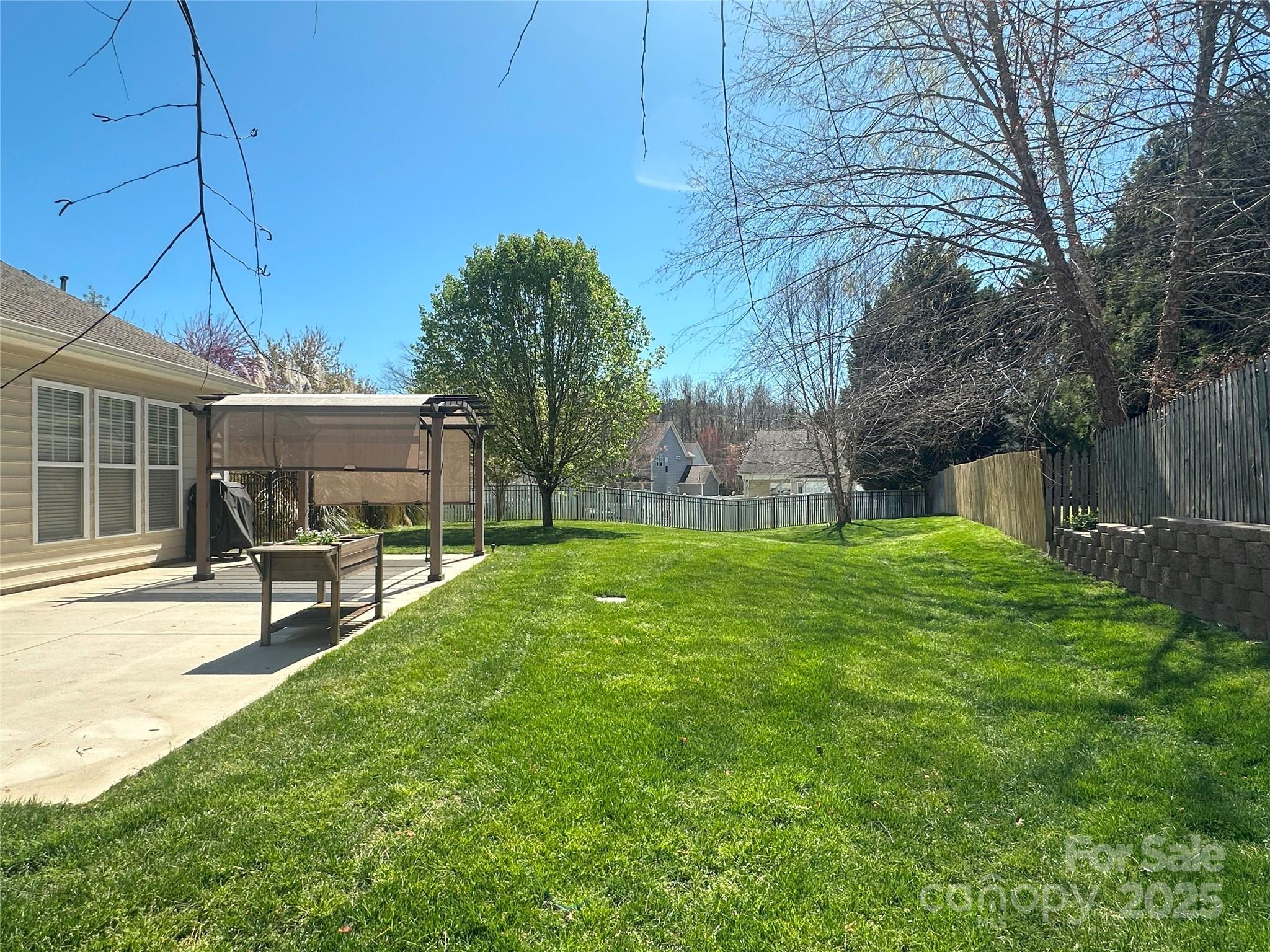 460 Silver Cypress Lane Fort Mill, SC 29708 - Photo 26 of 29 a view of a house with backyard and a tree