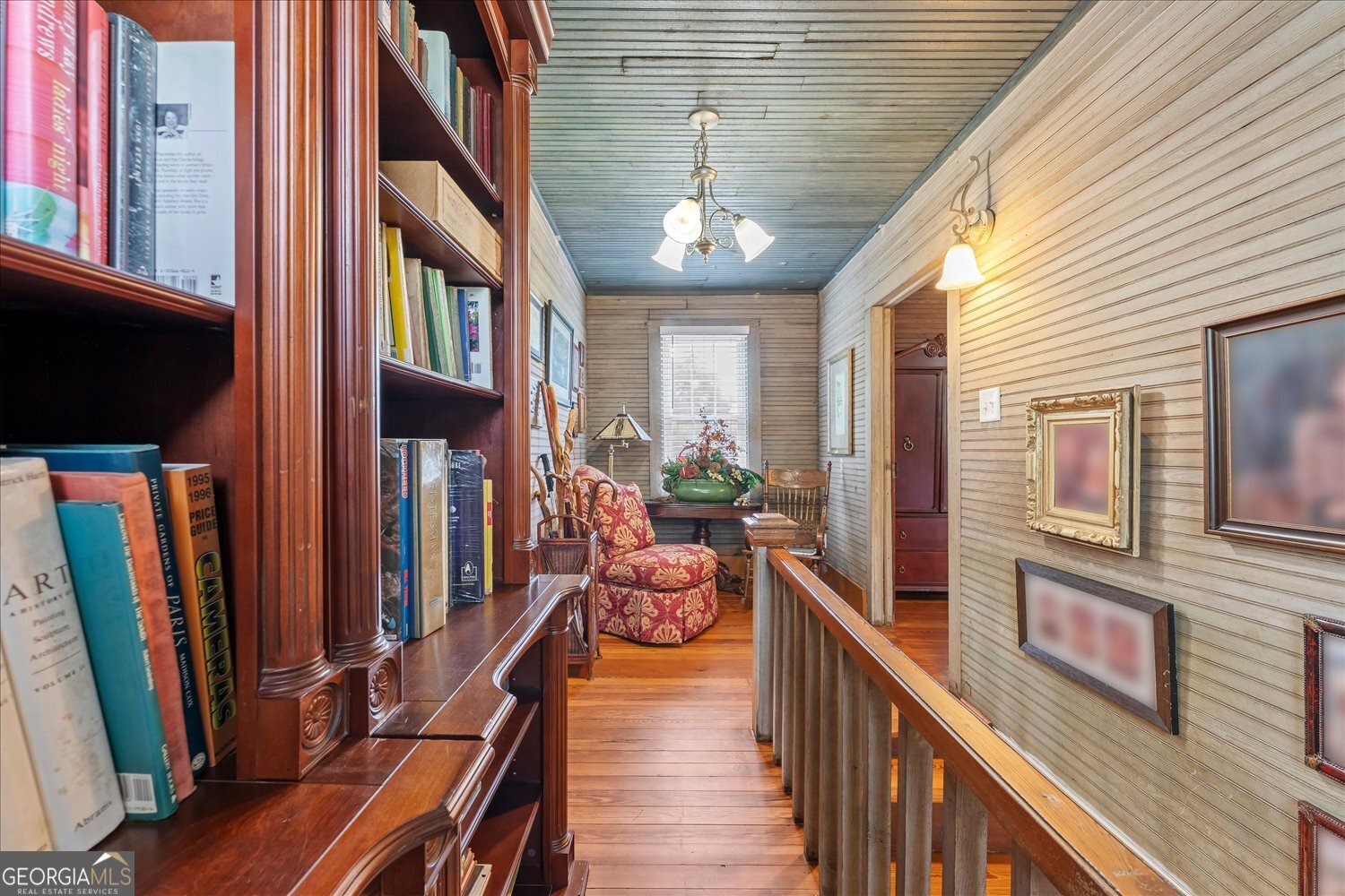 6644 East Cadley Road Norwood, GA 30821 - Photo 34 of 53 a view of a hallway with couches next to a large window with wooden floor