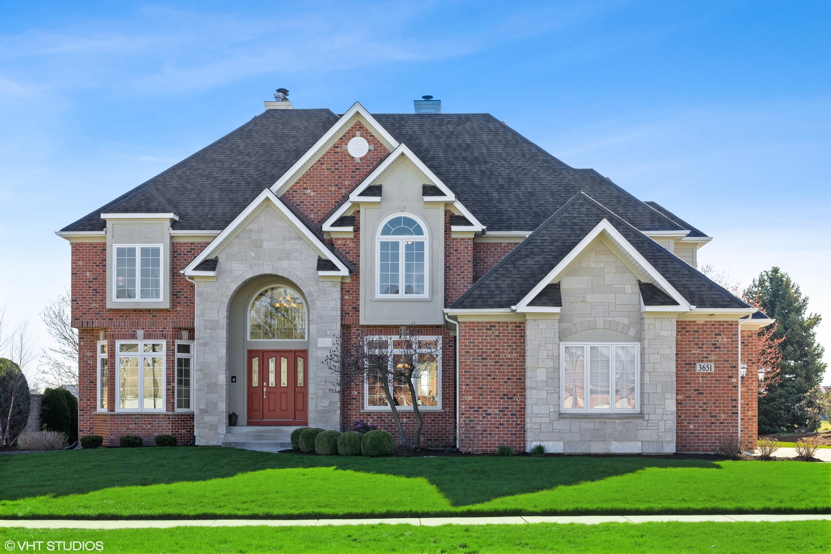 3651 White Eagle Drive Naperville, IL 60564 - Photo 2 of 47 a front view of a house with a yard