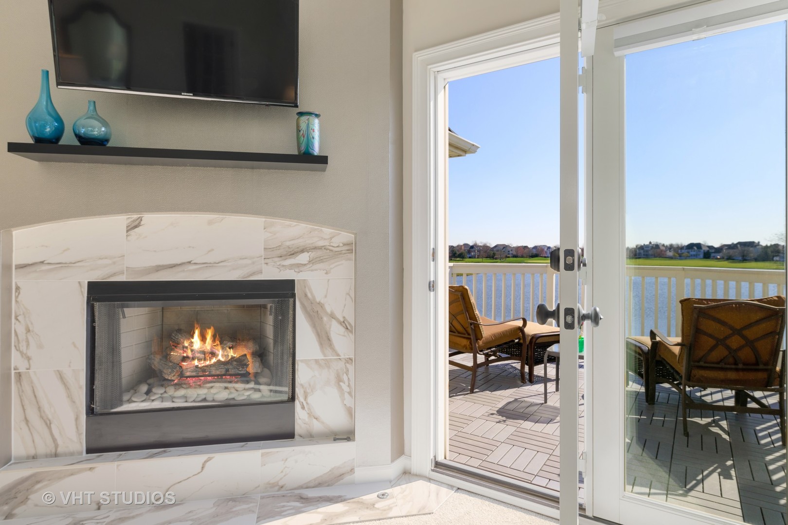 3651 White Eagle Drive Naperville, IL 60564 - Photo 20 of 47 a living room with furniture a fireplace and a floor to ceiling window