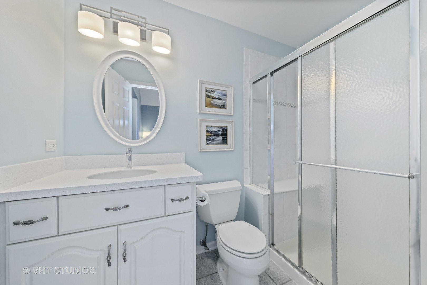 3651 White Eagle Drive Naperville, IL 60564 - Photo 27 of 47 a bathroom with a toilet a sink and mirror