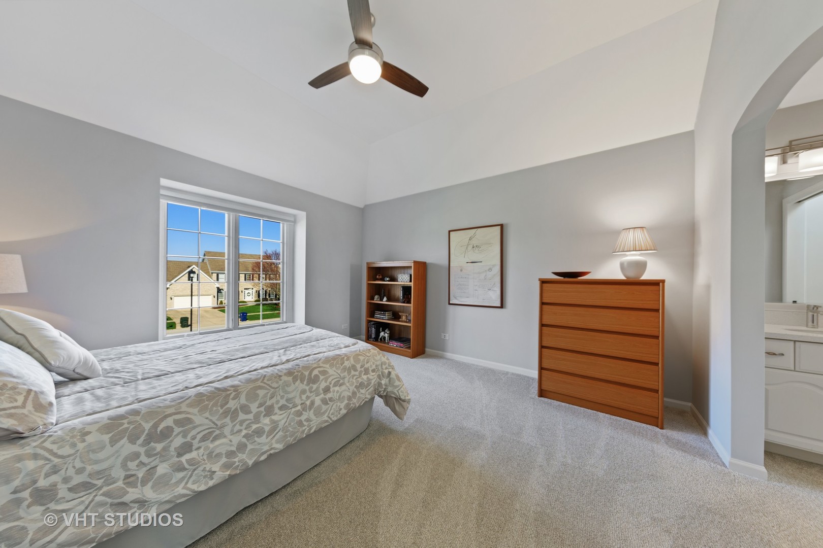 3651 White Eagle Drive Naperville, IL 60564 - Photo 28 of 47 a bedroom with a bed and a chandelier