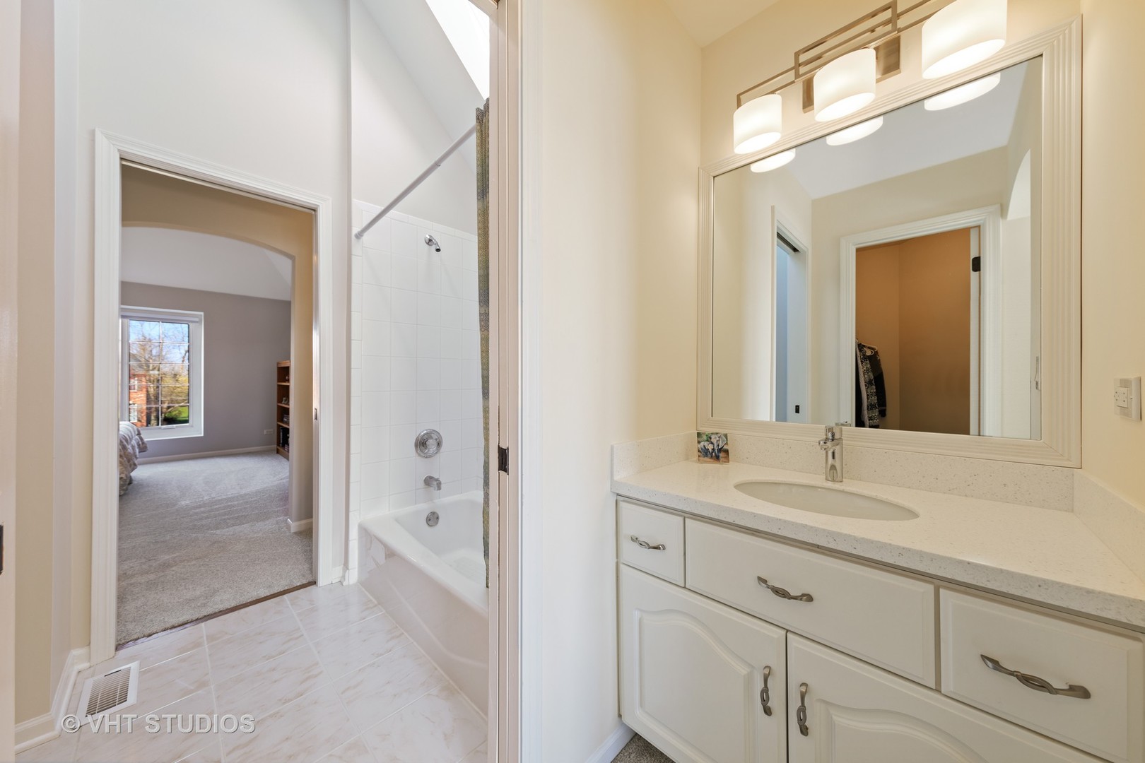 3651 White Eagle Drive Naperville, IL 60564 - Photo 30 of 47 a en suite bathroom with a sink shower and a mirror