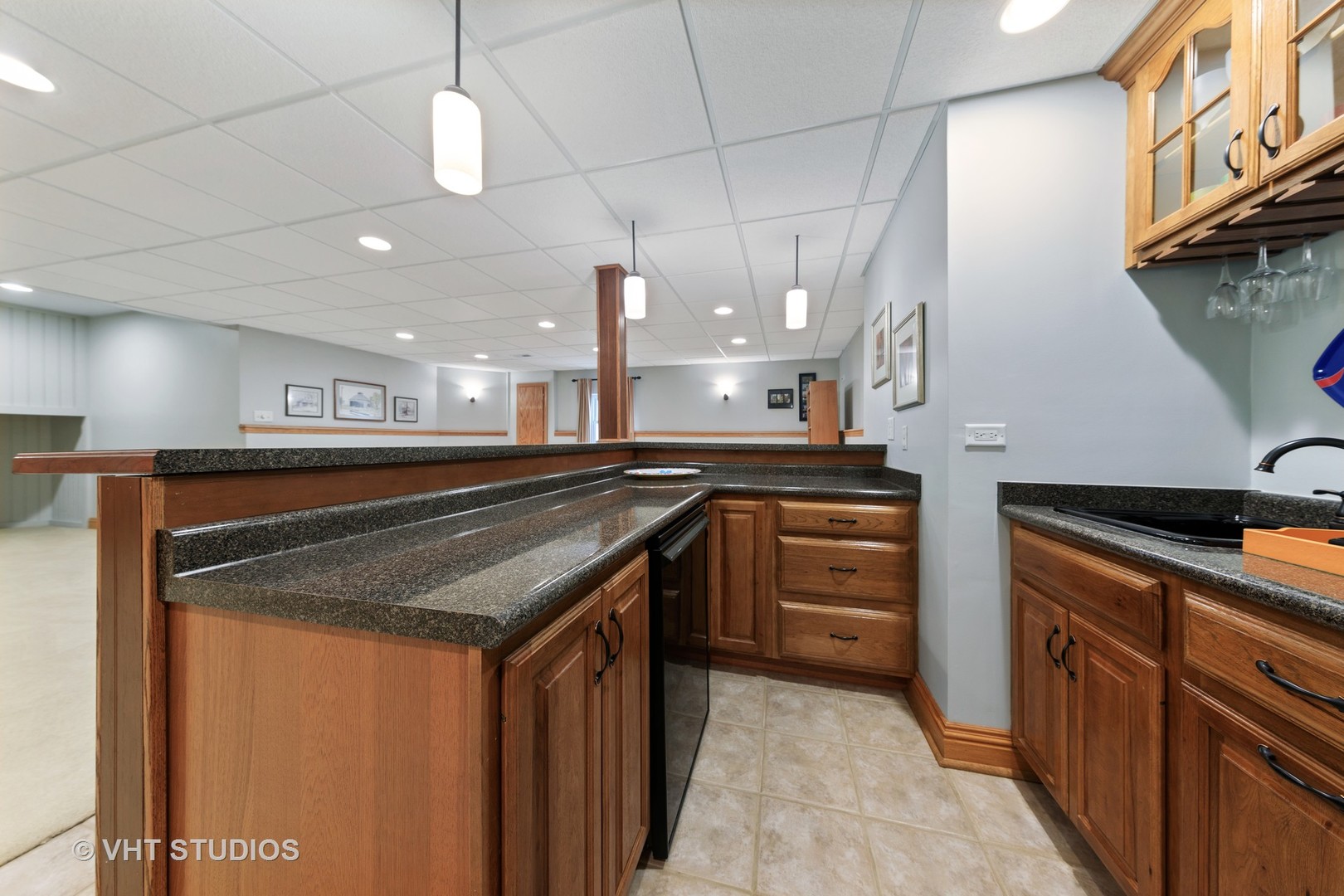 3651 White Eagle Drive Naperville, IL 60564 - Photo 34 of 47 a kitchen with stainless steel appliances granite countertop a sink and stove top oven