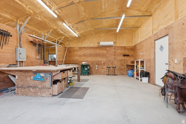 2925 Juniper Road Enterprise, UT 84725 - Photo 43 of 56 Garage featuring a workshop area, wood walls, and electric panel