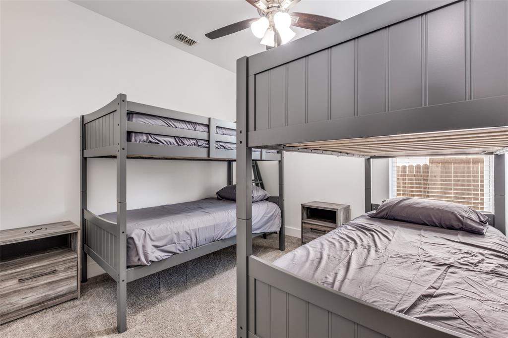 519 High Street Dallas, TX 75203 - Photo 11 of 13 a bedroom with a bed and a fireplace