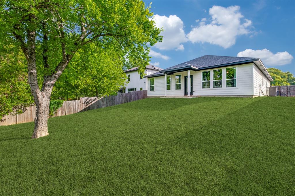 519 High Street Dallas, TX 75203 - Photo 13 of 13 a view of house in front of a big yard with large trees
