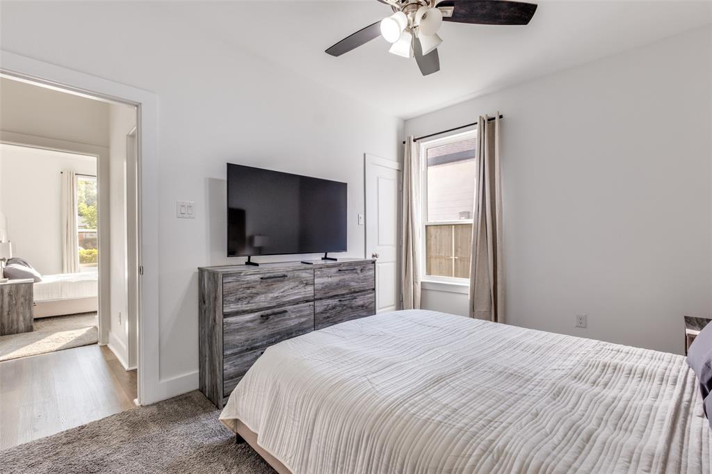 519 High Street Dallas, TX 75203 - Photo 7 of 13 a bedroom with a bed and a flat screen tv
