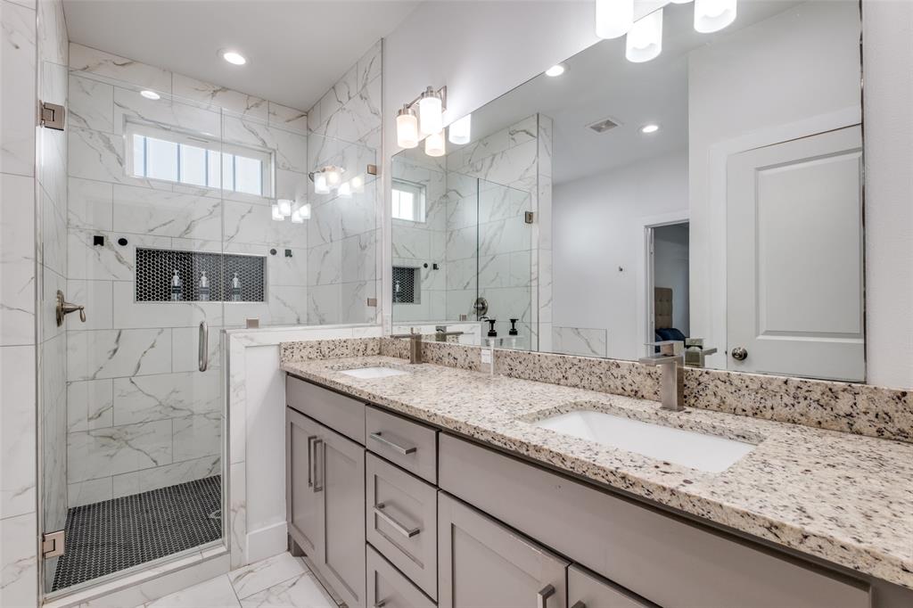 519 High Street Dallas, TX 75203 - Photo 9 of 13 a bathroom with a sink double vanity and a shower