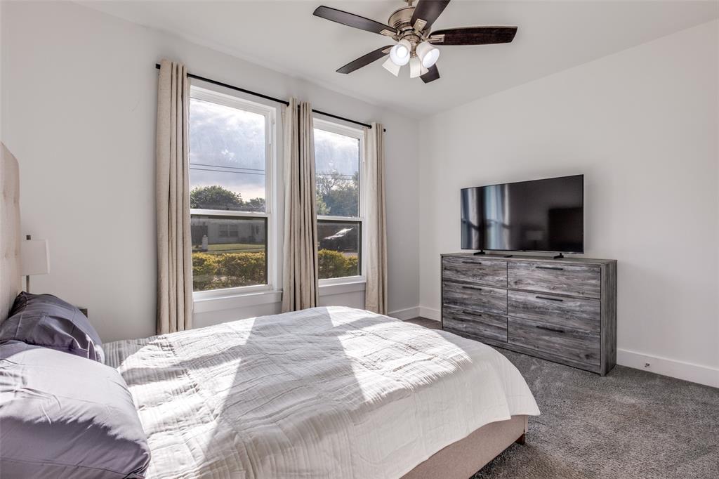 519 High Street Dallas, TX 75203 - Photo 10 of 13 a bedroom with a bed and a flat screen tv