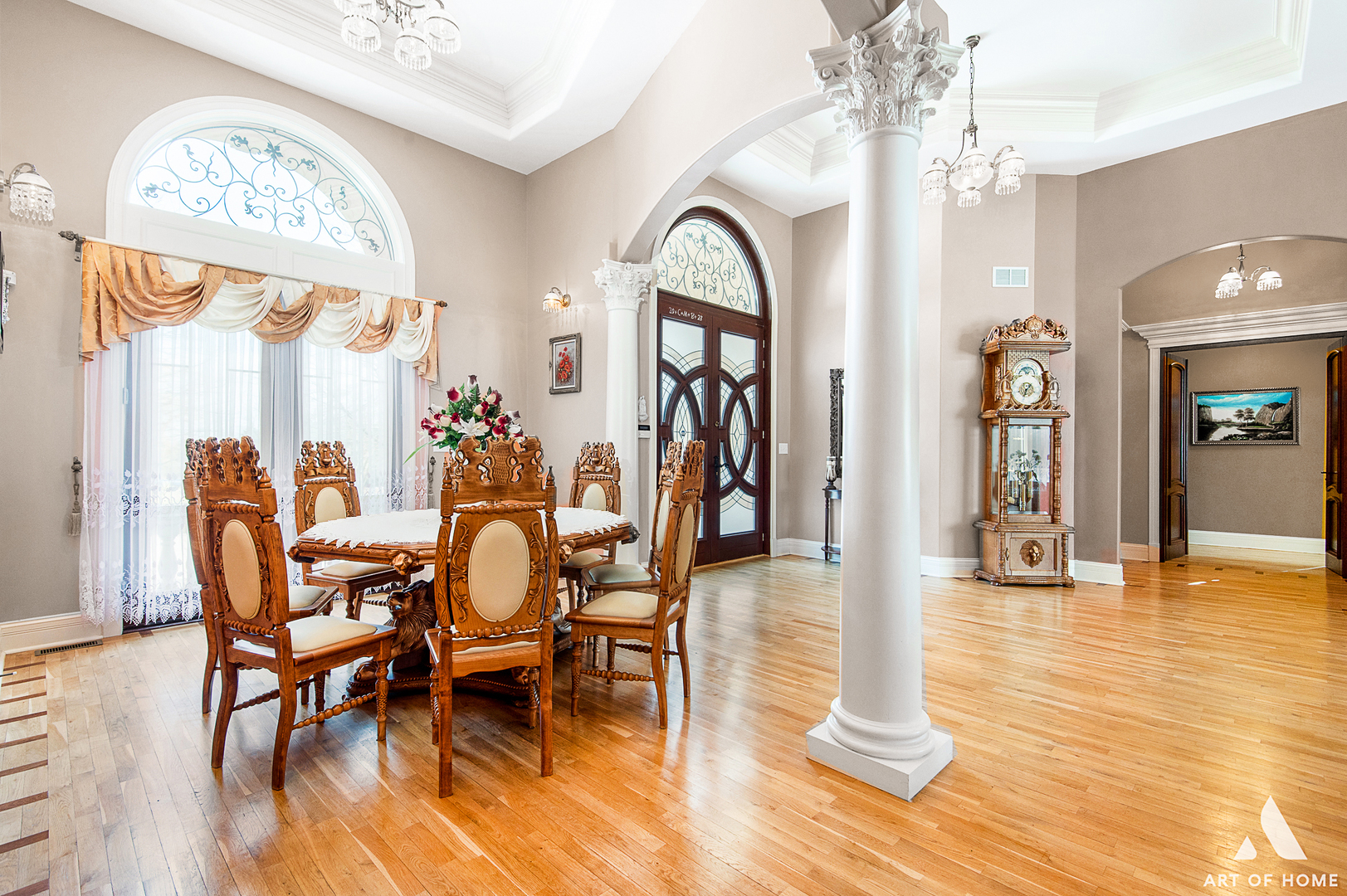 14940 El Greco Street Lemont, IL 60439 - Photo 15 of 67 a dining room with wooden floor a chandelier a glass table and chairs