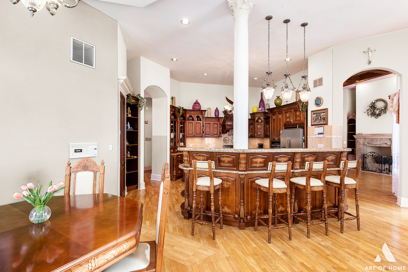 14940 El Greco Street Lemont, IL 60439 - Photo 22 of 67 a dining hall with stainless steel appliances kitchen island granite countertop a dining table chairs and a kitchen view