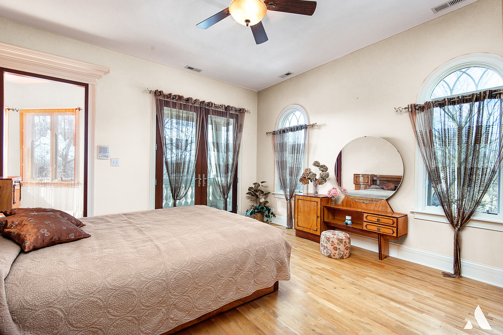 14940 El Greco Street Lemont, IL 60439 - Photo 31 of 67 a bedroom with a bed and a chandelier