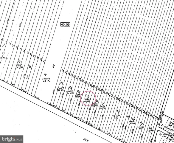 a view of a field with an ocean