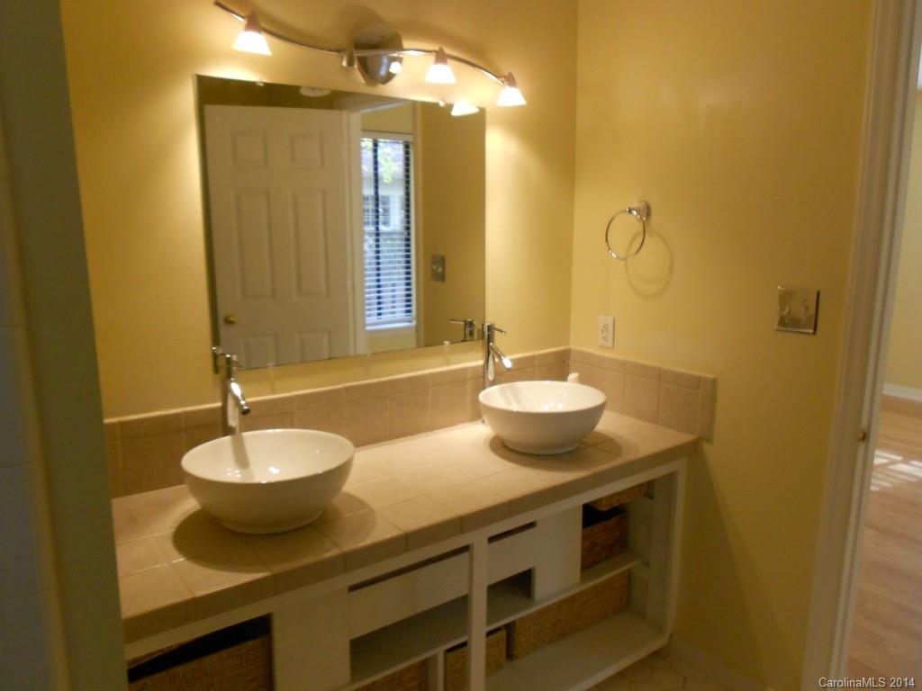 4135 Randolph Road, Unit 4 Charlotte, NC 28211 - Photo 12 of 22 a bathroom with a sink and a mirror