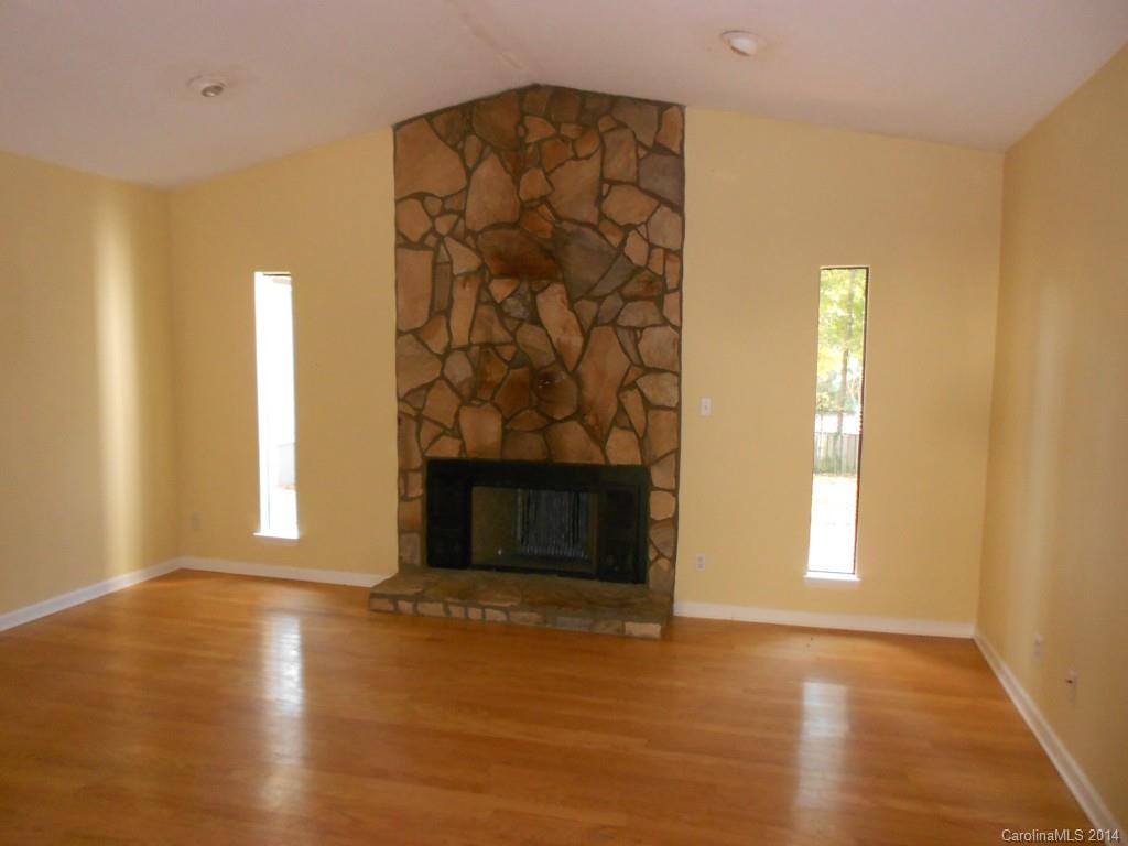 4135 Randolph Road, Unit 4 Charlotte, NC 28211 - Photo 3 of 22 an empty room with windows and fireplace
