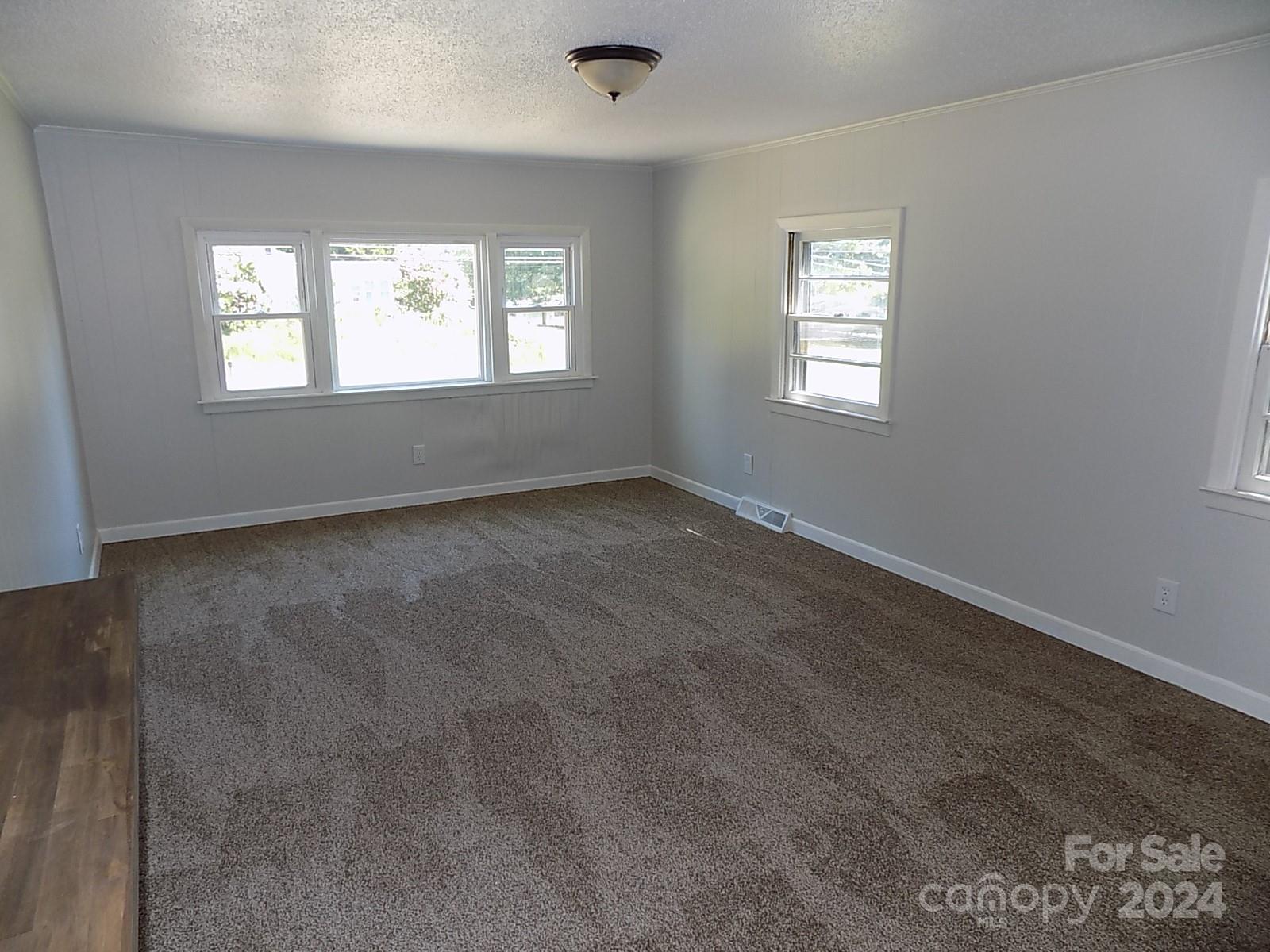 2435 Davis Park Road Gastonia, NC 28052 - Photo 4 of 10 a view of an empty room with a window