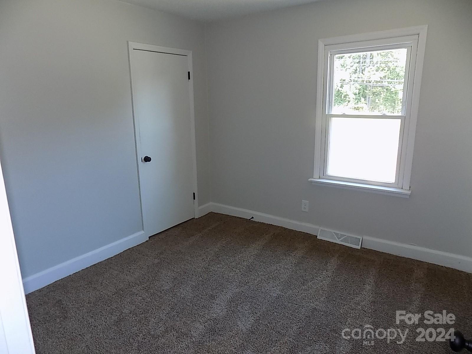 2435 Davis Park Road Gastonia, NC 28052 - Photo 6 of 10 an empty room with a window
