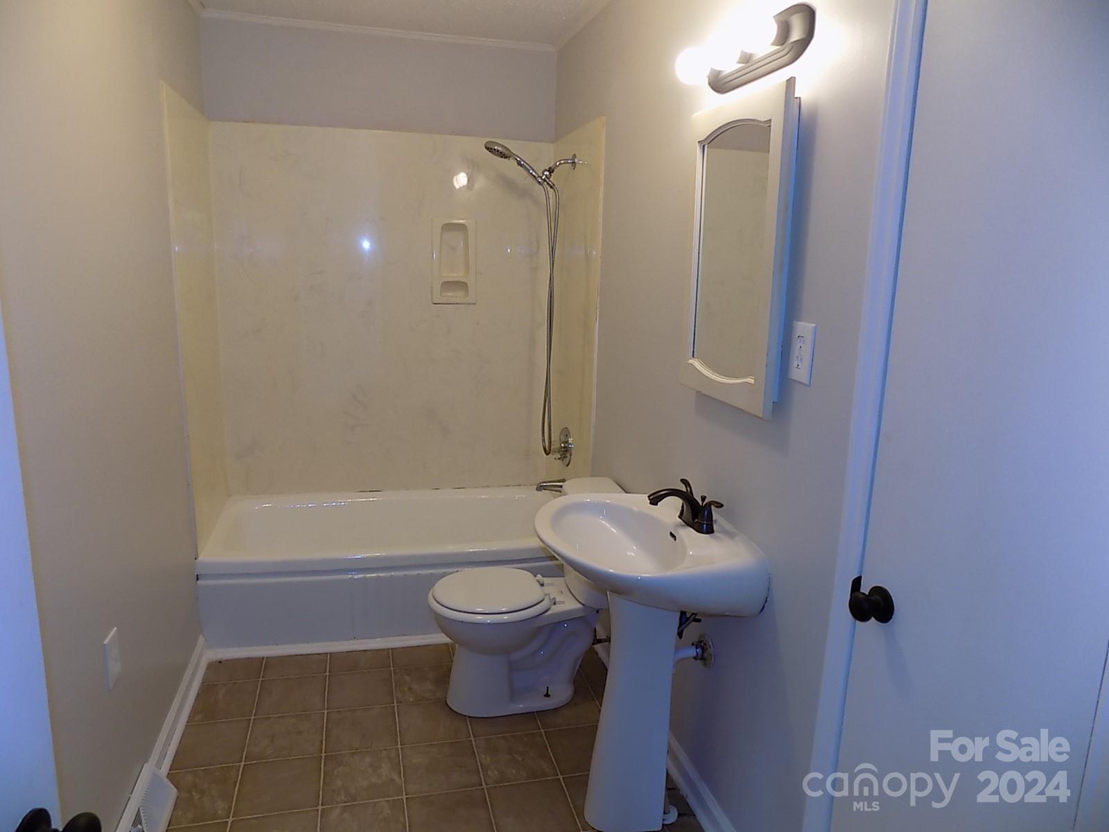 2435 Davis Park Road Gastonia, NC 28052 - Photo 7 of 10 a bathroom with a sink toilet and shower
