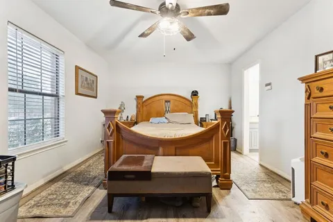 a living room with a table chairs and a window