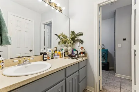 a bathroom with a sink double vanity and a mirror