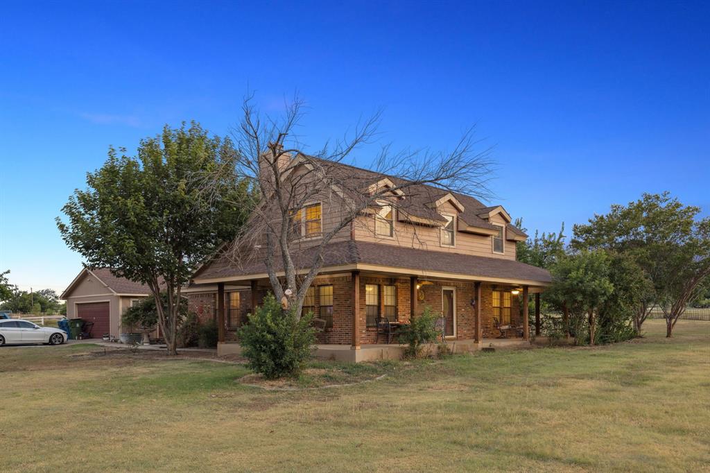 202 Blue Mound Road East Haslet, TX 76052 - Photo 28 of 36 a view of a building with a yard