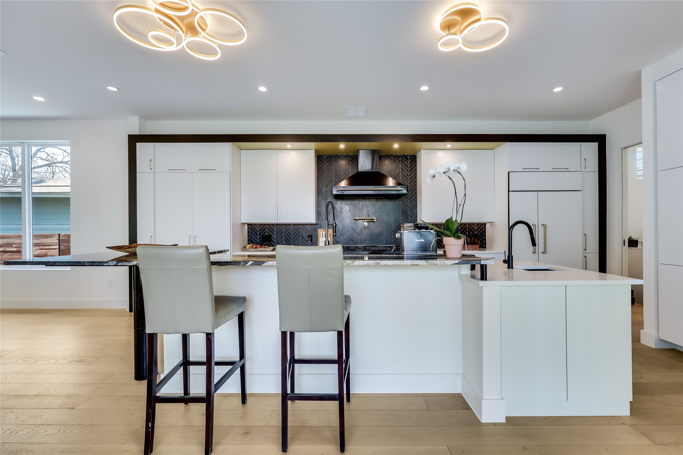 4600 Gillis Street Austin, TX 78745 - Photo 17 of 40 a kitchen with a table chairs stove and microwave