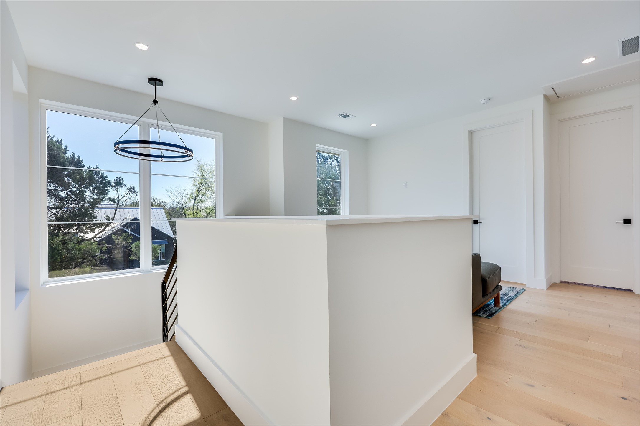 4600 Gillis Street Austin, TX 78745 - Photo 23 of 40 a view of a hallway with a chandelier