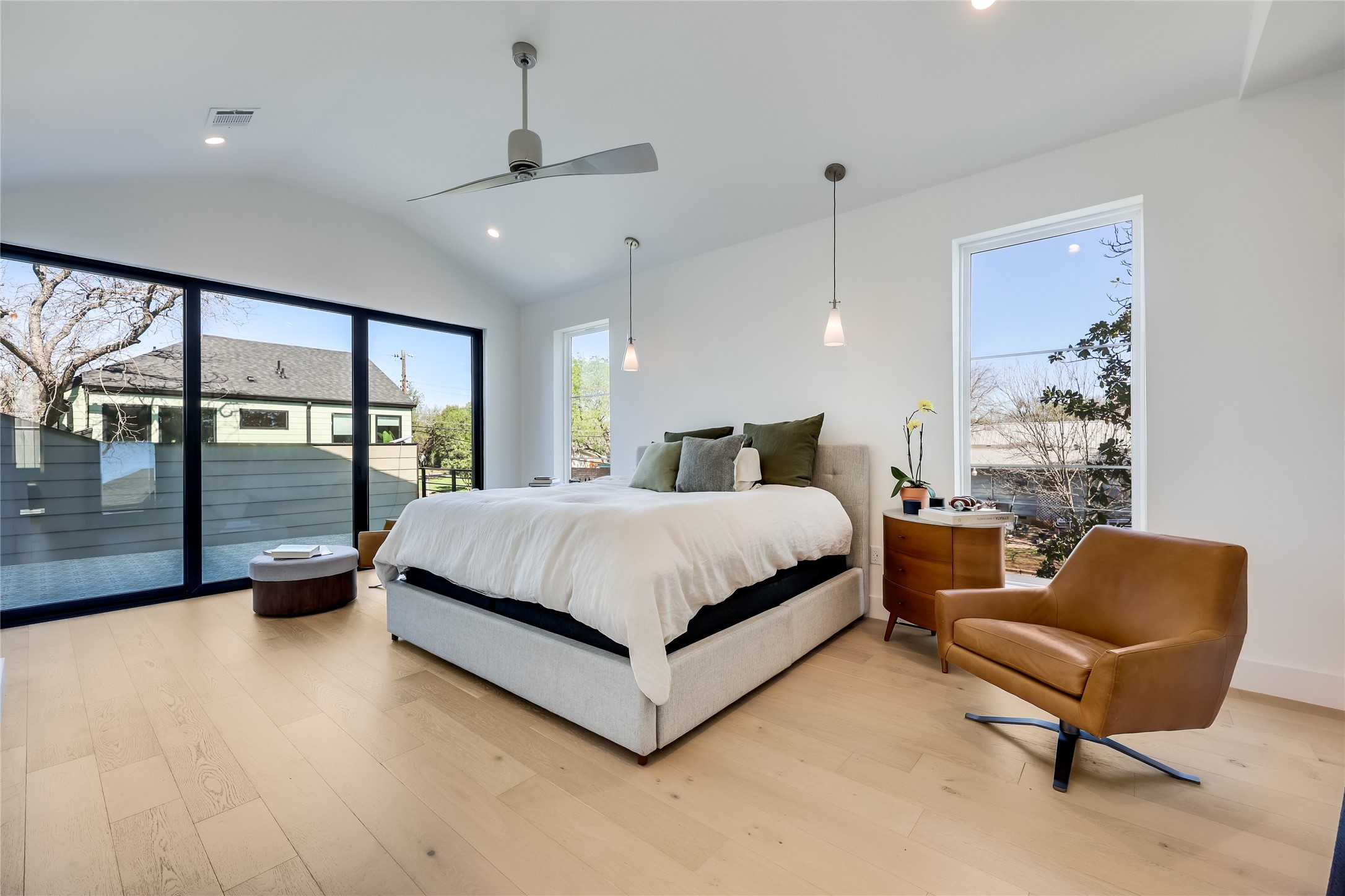 4600 Gillis Street Austin, TX 78745 - Photo 3 of 40 a bedroom with a bed and large window