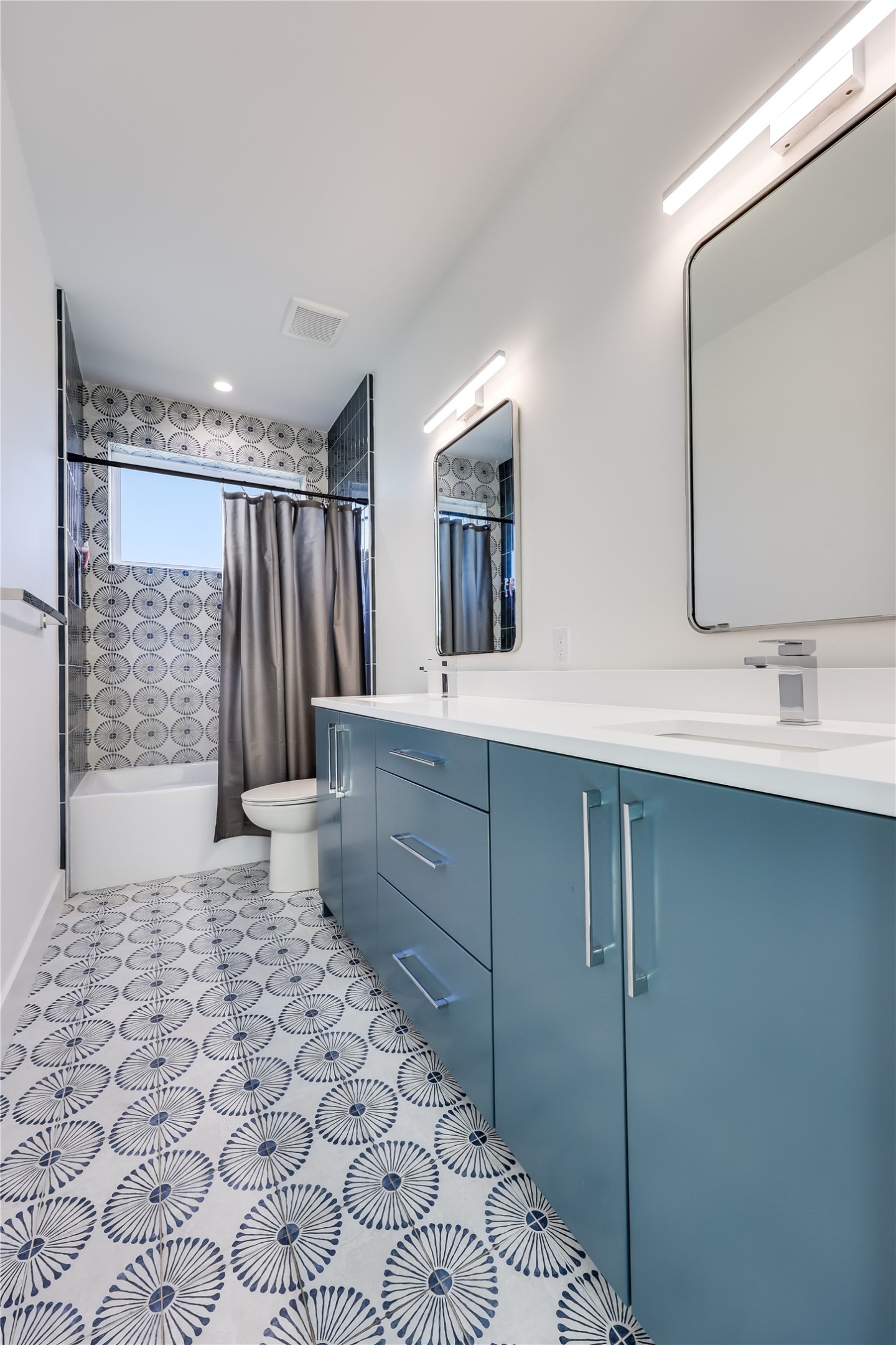 4600 Gillis Street Austin, TX 78745 - Photo 31 of 40 a bathroom with a sink a toilet and mirror