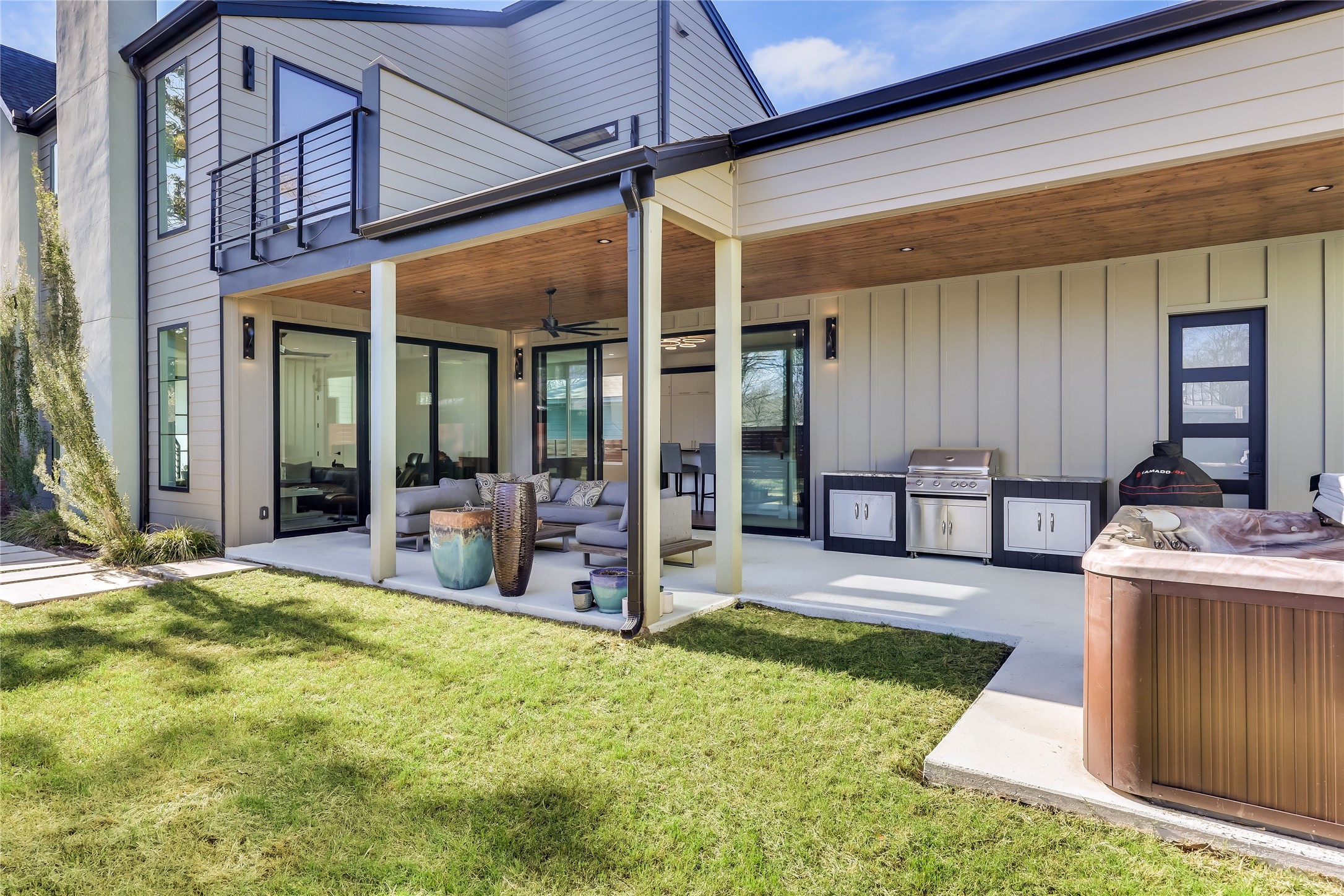 4600 Gillis Street Austin, TX 78745 - Photo 6 of 40 a view of a house with large windows and a table and chairs