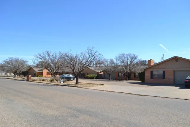 a view of a house with a snow on the road