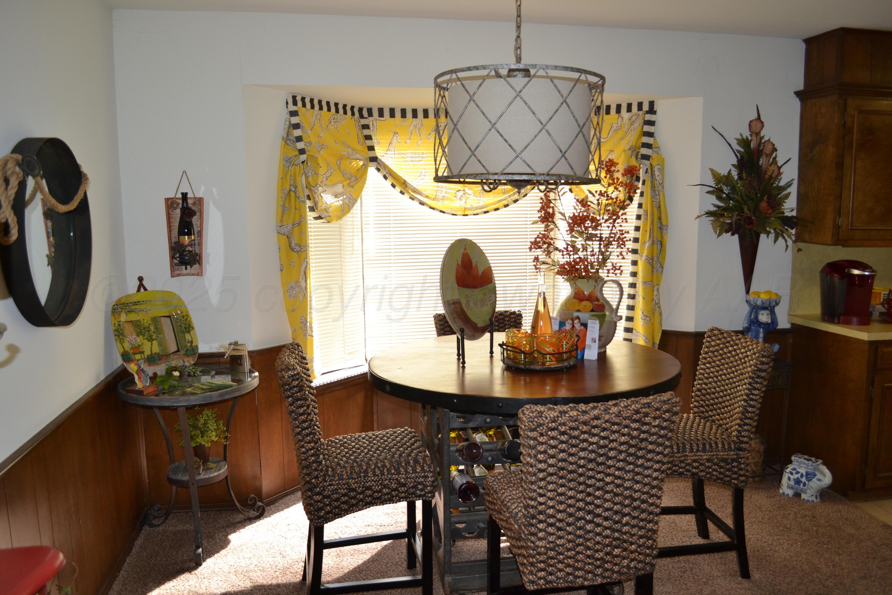 4307-4311 West 2nd Street Plainview, TX 79072 - Photo 28 of 51 a dining room with furniture and wooden floor